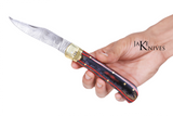 Click to open folding knife with its Damascus blade