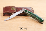 Folding knife with its green wood handle