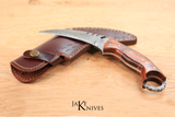 Hunting knife with curved Damascus blade