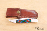 Folding knife with its multicolor handle in resin