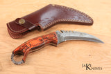 Hunting knife with curved Damascus blade