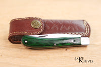 Folding knife with its green wood handle