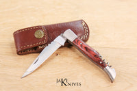 Folding knife with corkscrew