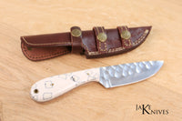 Hunting knife with its white resin handle